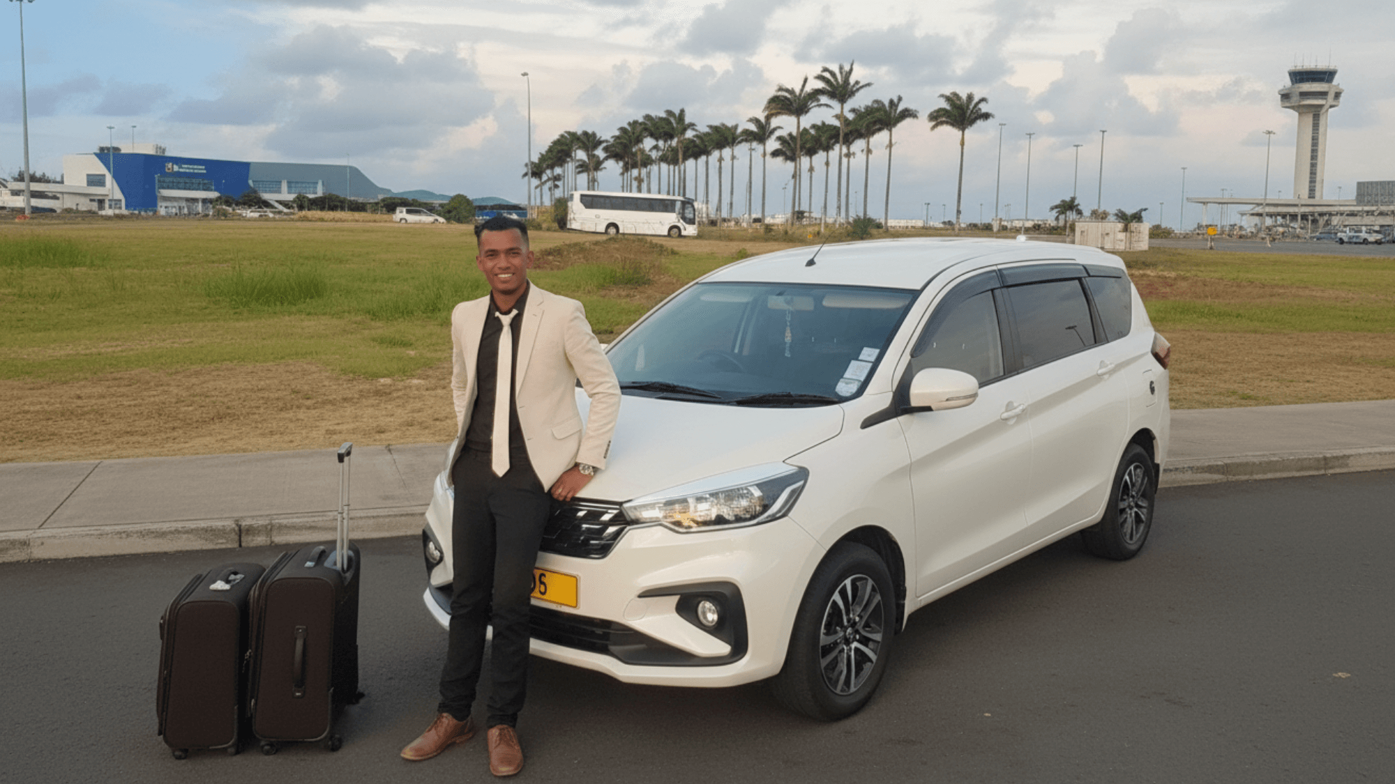Professional driver beside a white SUV at Mauritius airport ready for transfer service